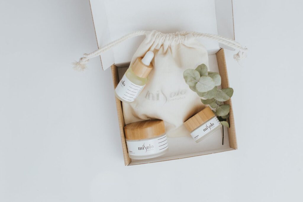 A flat lay of eco-friendly cosmetics including serum and cream in sustainable packaging.